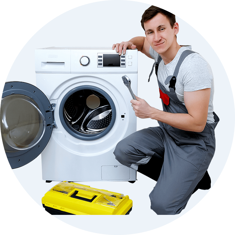 Technician in gray overalls holding a wrench next to a washing machine, showcasing appliance repair expertise and service readiness for customers seeking washing machine repairs.