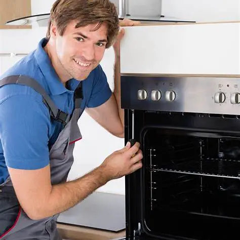 Technician repairing a Wolf stove, showcasing expertise in appliance service and maintenance.